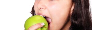 girl eating apple, Sioux City dentist